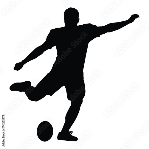 Dynamic silhouette of a soccer player kicking a ball in mid-action sports photography silhouette