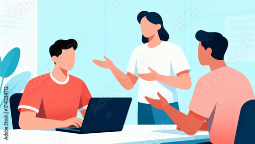 Three people collaborating at a desk with laptop