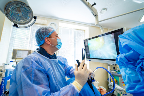Tableau sur toile Doctor performing endoscopy with medical monitor