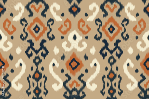 Ethnic seamless ikat fabric pattern. Traditional geometric tribal fabric pattern in beige, navy and terracotta tones. Decorated with abstract fabric. Vintage woven background for clothing.