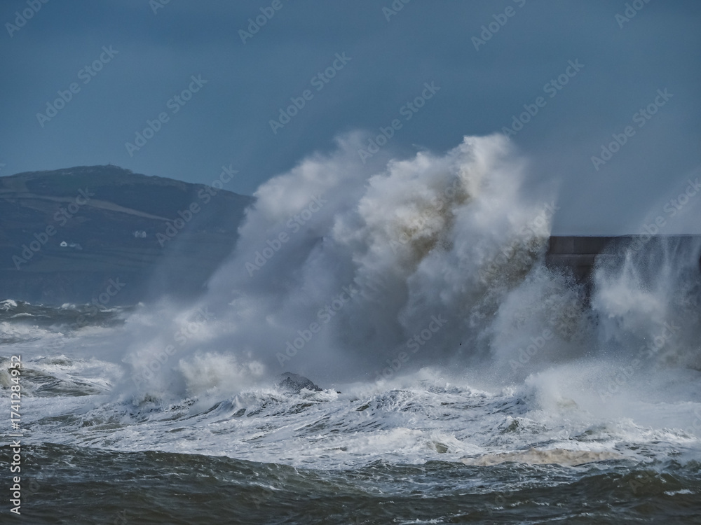 Fototapeta premium crashing waves over Holyhead breakwater isle of Anglesey