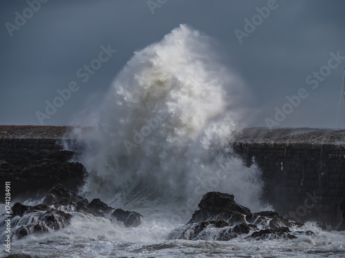 crashing waves over Holyhead breakwater isle of Anglesey