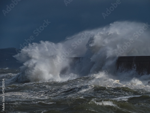 crashing waves over Holyhead breakwater isle of Anglesey