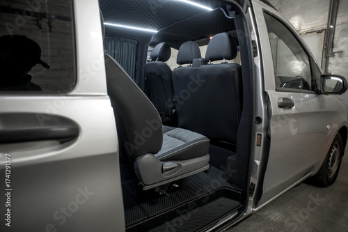 Comfortable interior of a passenger bus with soft seats