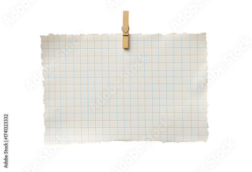Torn graph paper with a wooden clip, perfect for notes, reminders, or creative projects