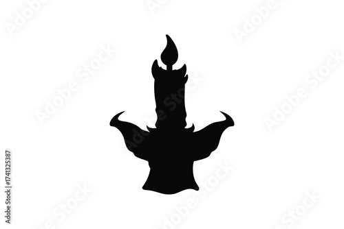 Silhouette of a gothic candelabra with a single lit candle casting shadows
