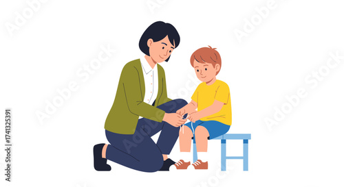Mother tending to her sons injured knee providing comfort and care.