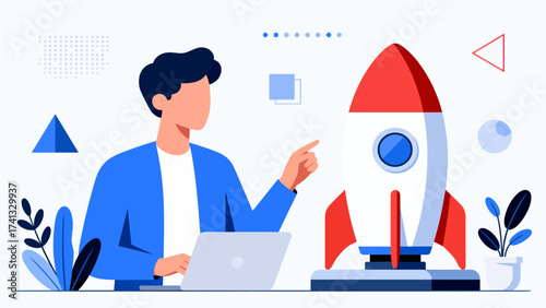 Man pointing at rocket near laptop