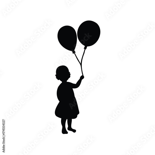 Silhouette of a young child holding two balloons up in the air