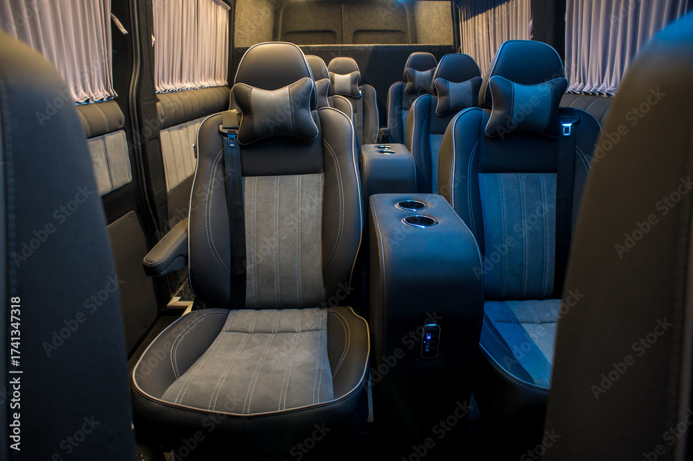 Fototapeta premium Comfortable interior of a passenger bus with soft seats