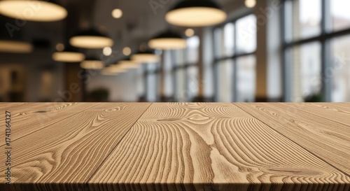 Empty wooden table with blurred background of a modern cafe or restaurant, perfect for product display.