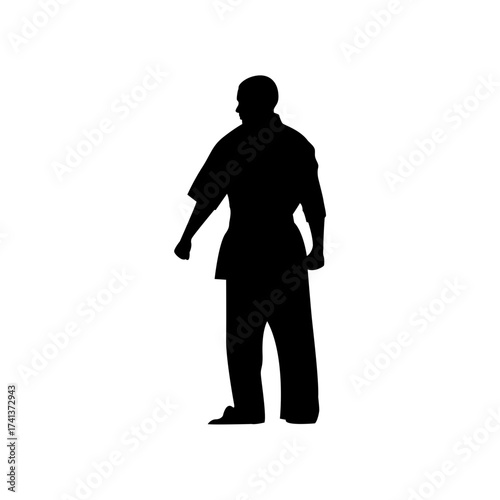 This silhouette depicts a karate practitioner in a traditional uniform, showcasing the discipline and focus inherent in this martial art. The figure stands still, ready for action.