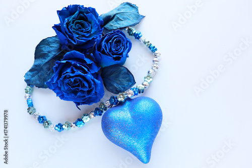 Greeting card mockup with blue roses on a white background
