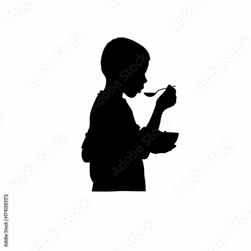 Silhouette of a boy eating breakfast cereal isolated on white background