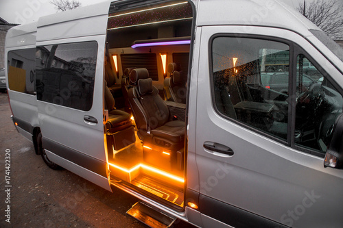 Comfortable interior of a passenger bus with soft seats