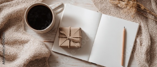 The Cozy Notebook Desk Scene with Coffee and Gift Wrapped in Burlap