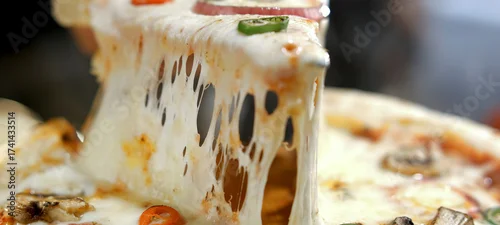 Panel kuchenny z motywem Hand lifting a pizza slice, showcasing the stretchy, gooey melted mozzarella cheese pull, highlighting the fresh and appetizing texture of the italian dish
