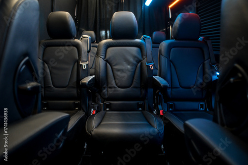 Comfortable interior of a passenger bus with soft seats