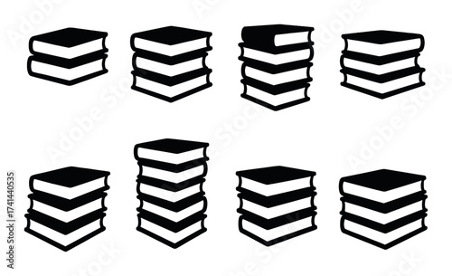 Black silhouetted stacks of books against dark background