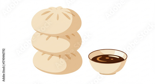 Steamed bao buns stacked with a small bowl of dipping sauce  