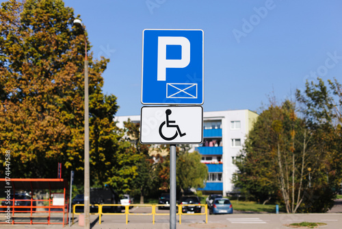 Wallpaper Mural Parking sign for disabled people. Blue information road sign with wheelchair symbol. Accessible parking lot for disabled drivers. Urban transport infrastructure and mobility accessibility. Torontodigital.ca