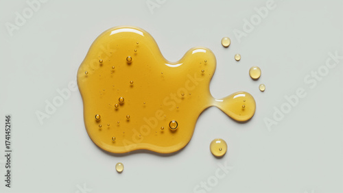 Abstract golden viscous liquid with air bubbles, like honey or serum, on grey background; for beauty, food, health, organic branding, web, print.