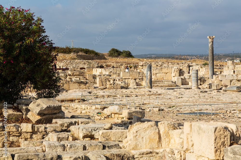 Fototapeta premium Ruins and remnants with columns of the Sanctuary and Temple of Apollo Hylates in an ancient Greek city-state called Kourion on the island of Cyprus