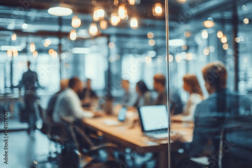 Blurred background of a business team working together in an office meeting room