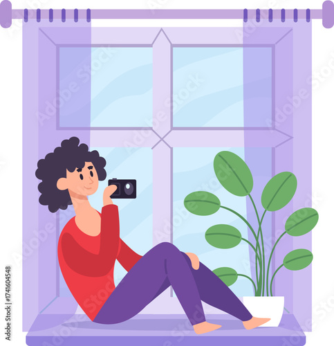 Woman photographing from home window, enjoying hobbies