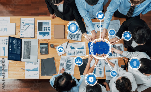 Quadro su tela A dynamic business meeting showcasing professionals engaged in data analysis, emphasizing security in a modern office environment filled with digital technology