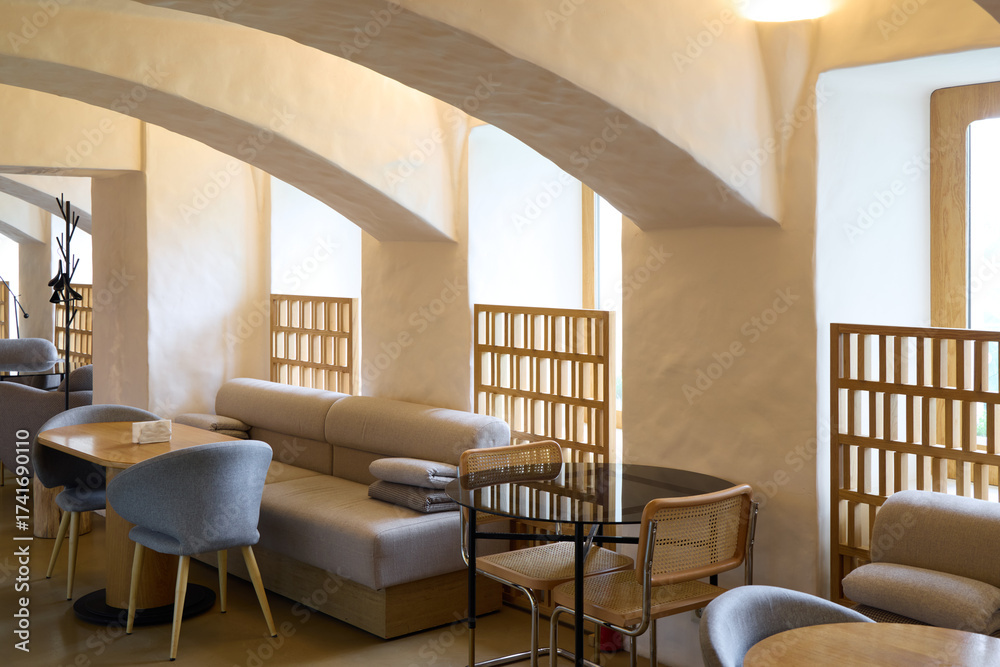 Fototapeta premium Modern Interior of a Stylish Caf with Minimalist Design