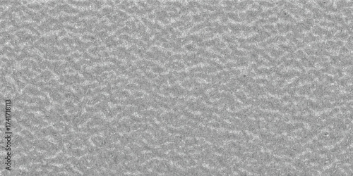 Detailed close-up of a rough metallic textured surface with a fine grain and subtle grey tones providing a robust industrial background element
