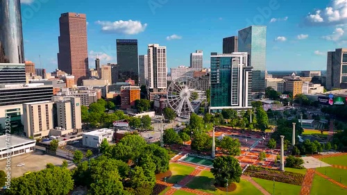 Vibrant aerial photo of Atlanta, Georgia showcasing downtown skyscrapers, Centennial Olympic Park, and green urban spaces. Perfect for real estate, travel, tourism, and business visuals