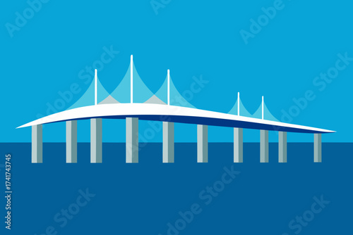 Modern cable stayed bridge spanning blue water under clear sky