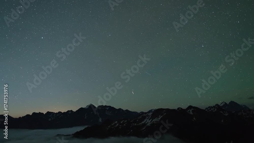 Starry Night Sky Time Lapse Over Snowy Mountains and Cloudy Sea of Fog