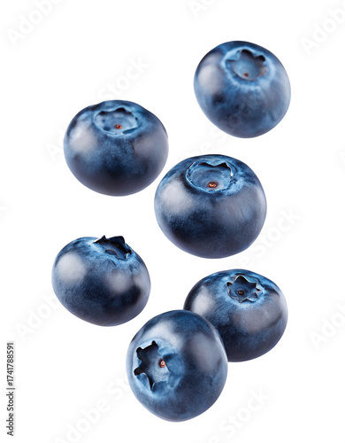 Fresh blueberries scattered and floating isolated on a