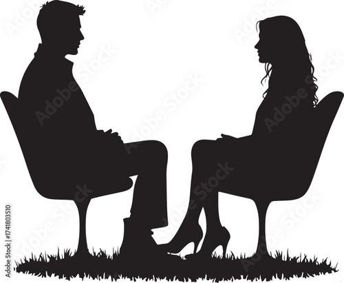 Man and woman silhouettes sitting in chairs facing each other on grass