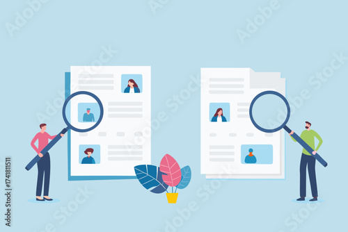 Two people examining resumes with magnifying glasses for hiring or recruitment process