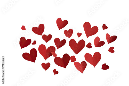 Red paper hearts, cut out and scattered against a stark black background