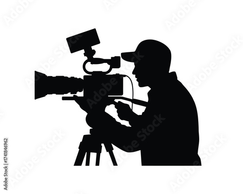 Black silhouette of a person operating a professional video camera on a tripod camera operator