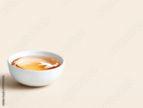 A serene image of a bowl filled with caramel-colored liquid, perfect for relaxation and mindfulness.