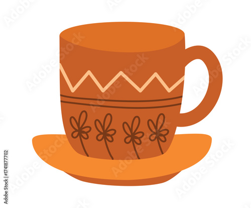 An orange ceramic mug with a decorative pattern and a matching saucer, isolated on a white background, perfect for a cozy beverage