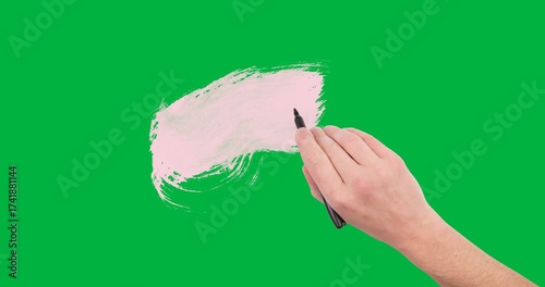 Hand holding a pen writing over pink paint stain against copy space on transparent background