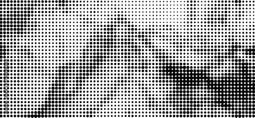 This striking high-contrast image showcases a field of dense black dots on a clean white backdrop, forming organic shapes and offering a contemporary abstract visual narrative