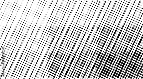 This captivating image showcases a halftone pattern of black dots on a white background, creating a visually engaging texture that transitions from sparse to dense across the frame