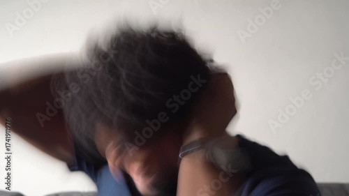Stressed man shaking head with motion blur