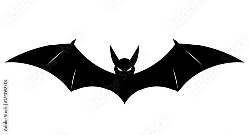 Silhouette of a fearsome black bat with outstretched wings in flight creating a spooky graphic for halloween or horror themes isolated on white background