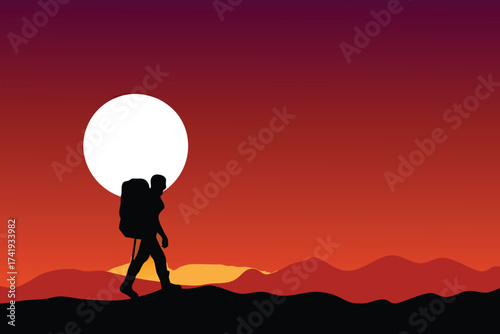 Silhouette of a hiker walking towards a large bright moon