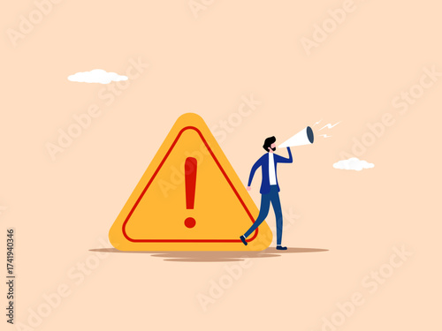 Businessman announces with warning sign