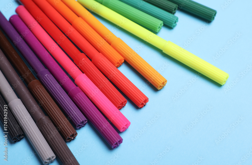 Fototapeta premium Set of colored pencils on a blue background